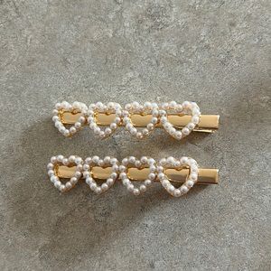 Brand new 3 3/4” gold alligator barettes with 4 faux heart pearls.